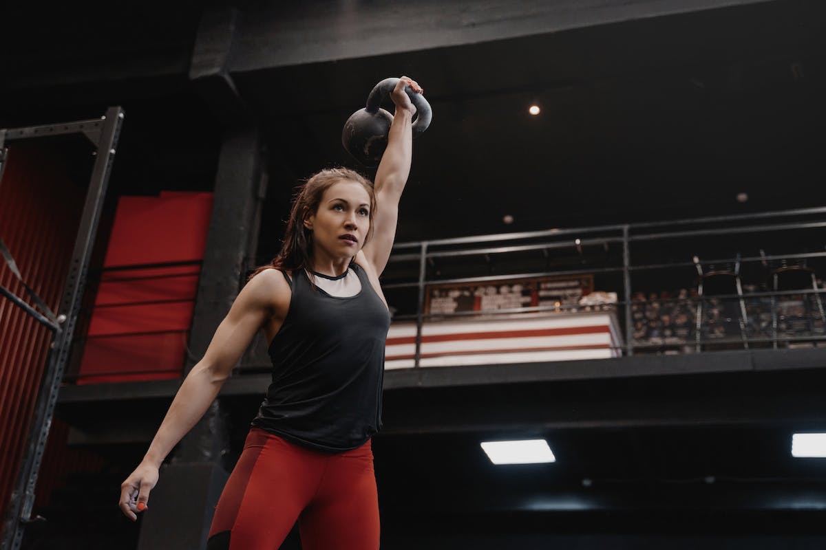 Woman doing an intense kettlebell workout