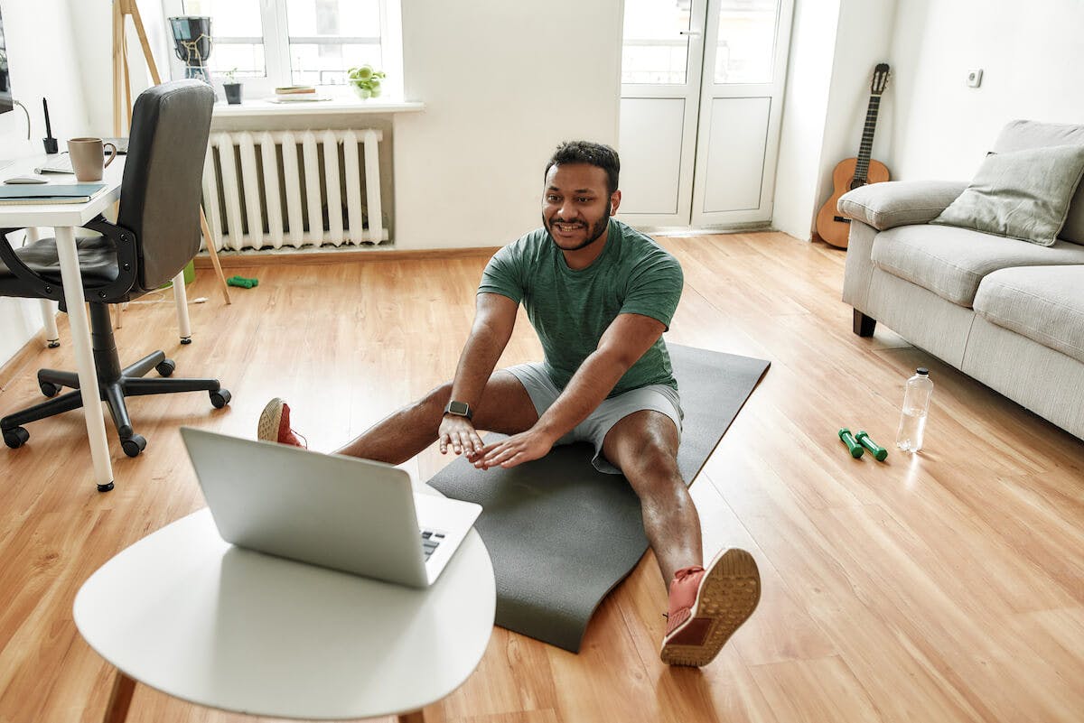 man-stretching-at-home