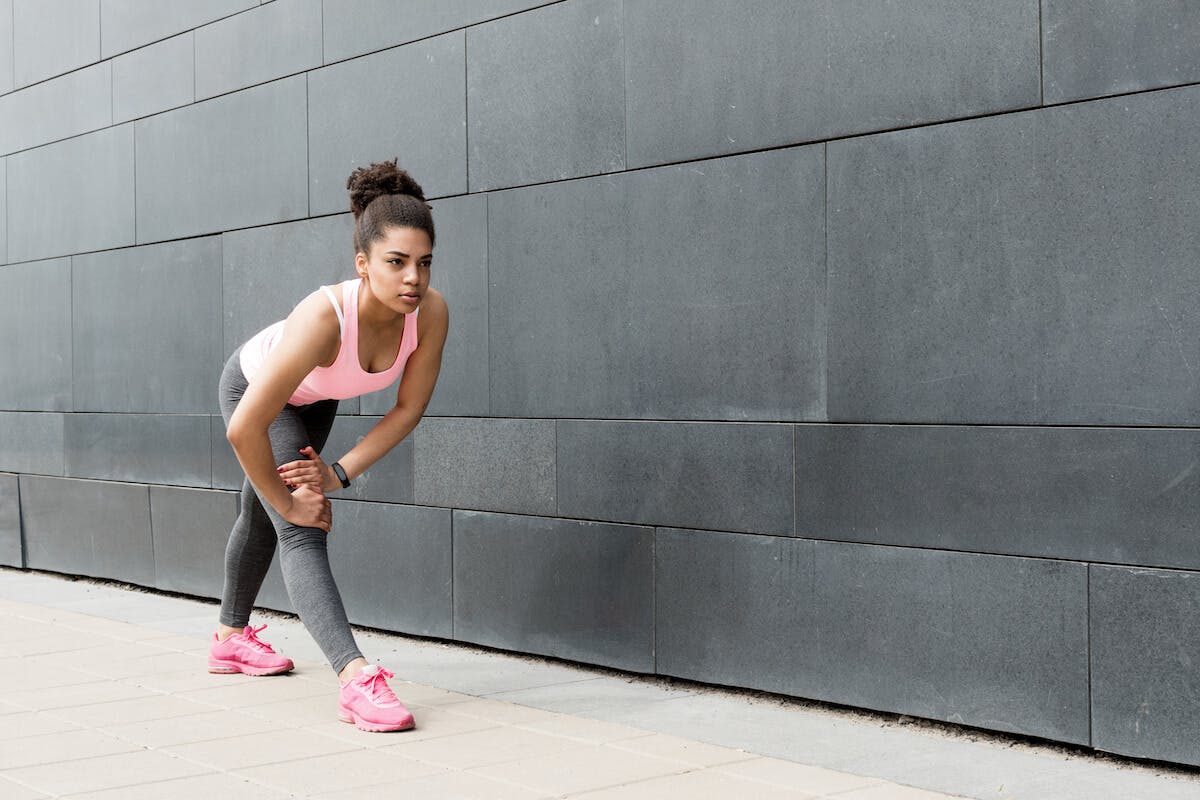 Fitness goals for women: woman stretching her leg