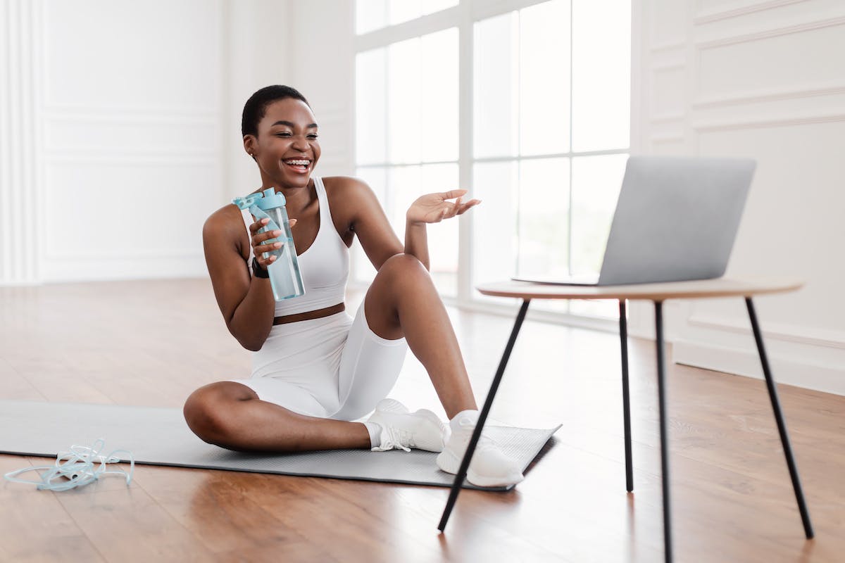 Woman chatting with her online personal trainer